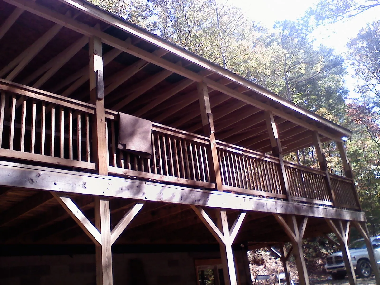 Timber framing under a new elevated porch and deck — Roof Leak Repair in Oregonia by Roofing Brothers